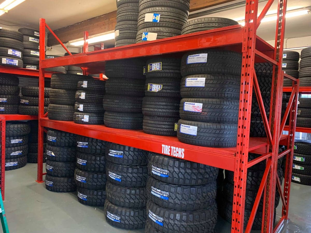 New and used tire inventory on the racks at BuySell Tires in Aldergrove, BC
